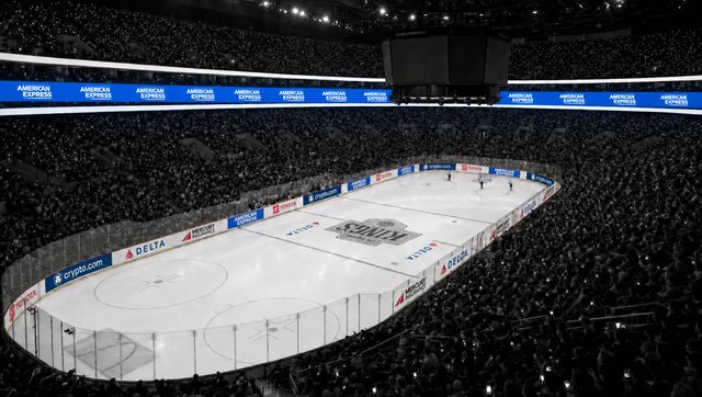 Crypto.com Arena at game lighting, the middle ribbon board carrying American Express